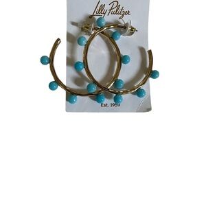 Lilly Pulitzer gold earrings with turquoise accents.